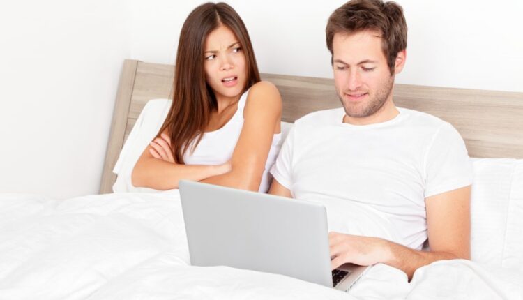 woman getting angry with her man who is watching porn